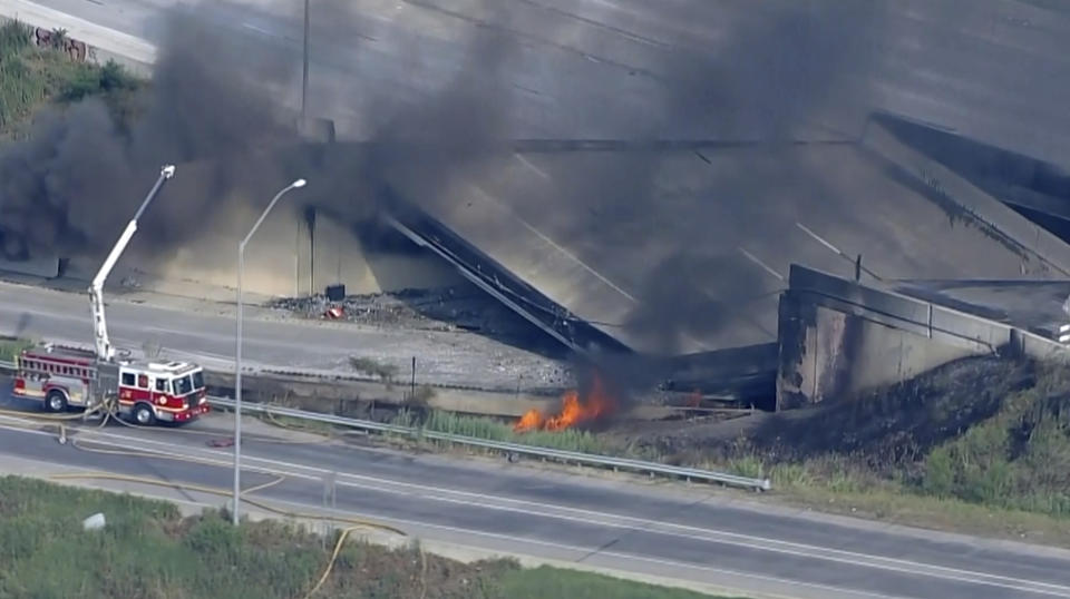 This screen grab from video provided by WPVI-TV/6ABC shows the collapsed section of I-95 with fire trucks on the scene in Philadelphia, Sunday, June 11, 2023. (WPVI-TV/6ABC via AP)