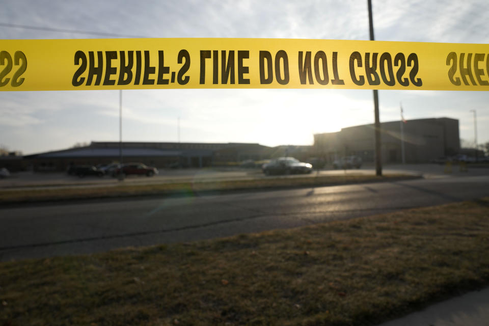 A sheriff's yellow tape is seen outside of Perry High School following a shooting Thursday at the school, Friday, Jan. 5, 2024, in Perry, Iowa. (AP Photo/Charlie Neibergall)