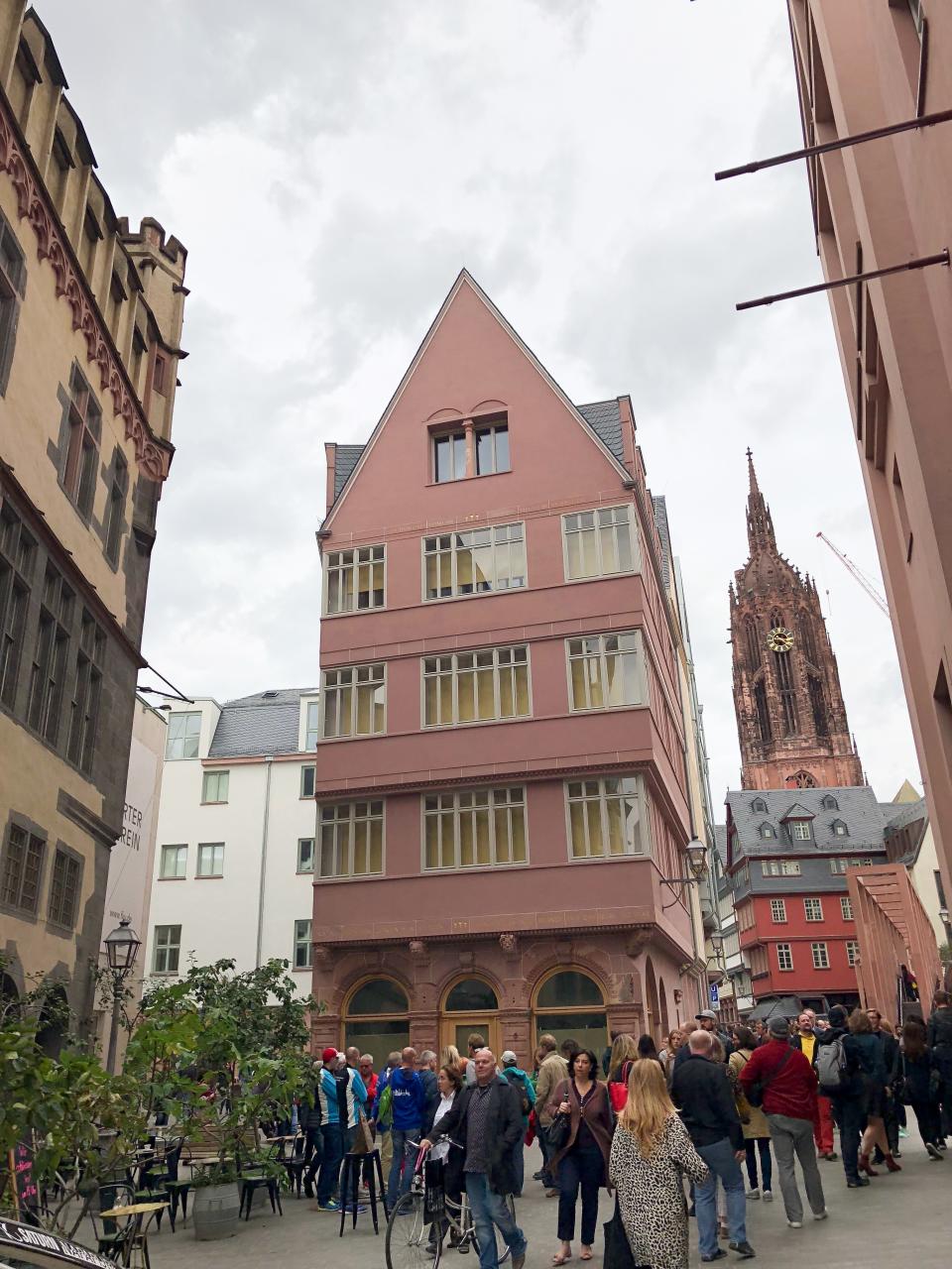 At street level, the narrow red building in Frankfurt's new old town is constructed of large stones, a material common in medieval times.