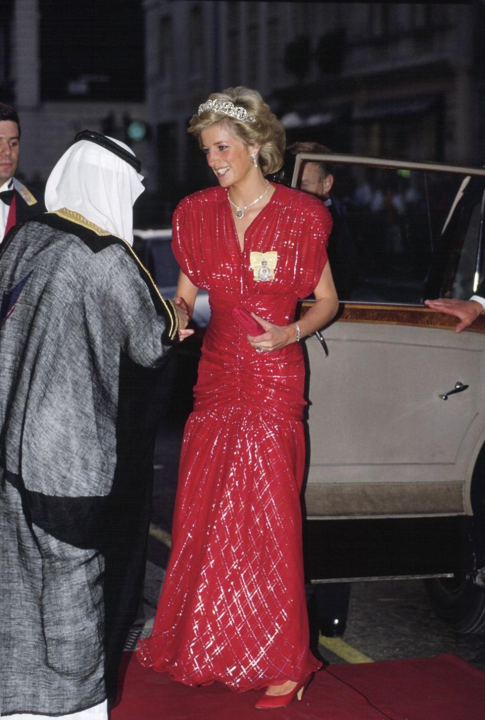 <p>Diana wore this head-to-toe red sparky gown with the Spencer tiara to a banquet held at Claridges in London. The dress was designed by Bruce Oldfield.</p>