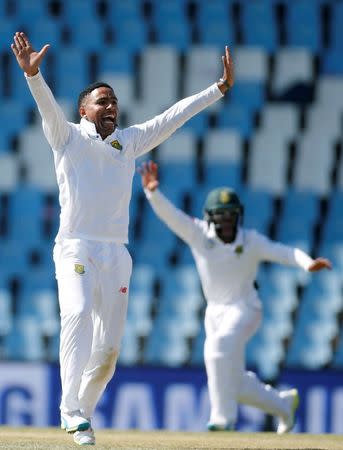 Cricket - New Zealand v South Africa - second cricket test match - Centurion Park, Centurion, South Africa - 30/8/2016. South Africa's Dane Piedt appeals successfully for the dismissal of New Zealand's BJ Watling. REUTERS/Siphiwe Sibeko