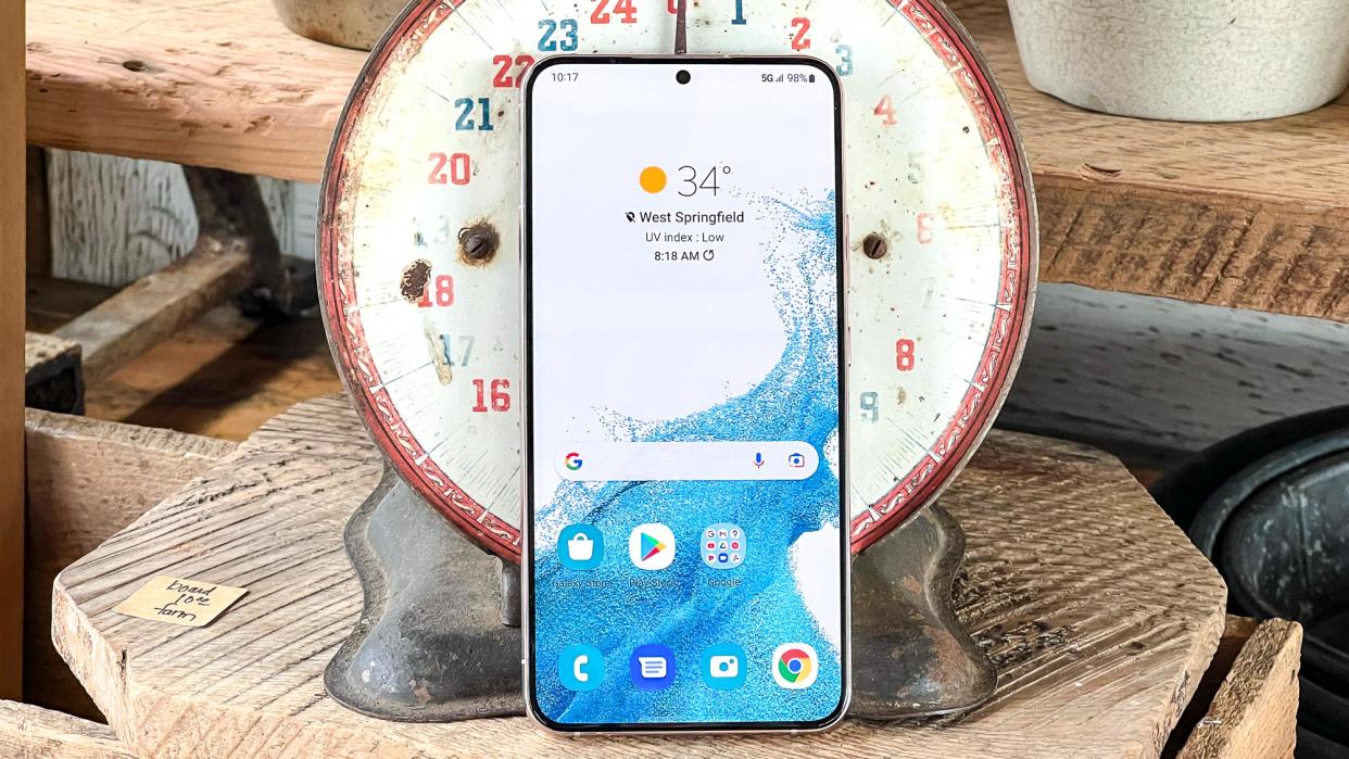  galaxy s22 plus display on leaning against old kitchen scale 