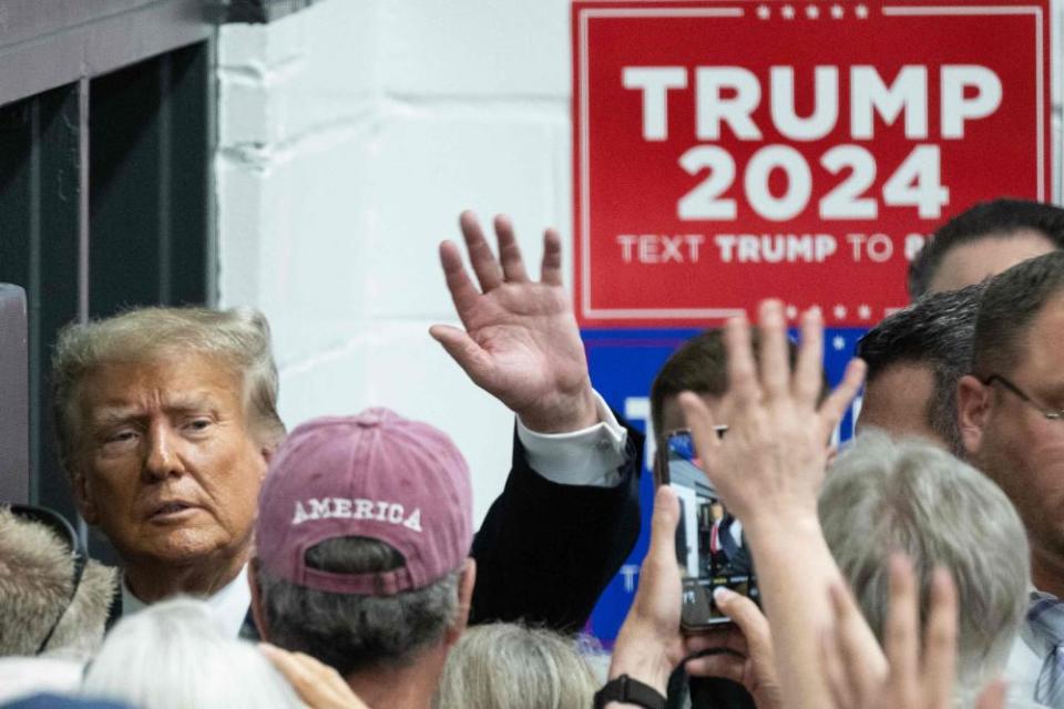 Donald Trump departs after speaking to supporters in Grimes, Iowa.