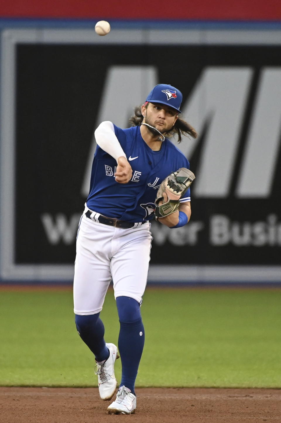 Toronto Blue Jays shortstop Bo Bichette throws to first base to put out Cleveland Indians' Oscar Mercado during the fifth inning of a baseball game Thursday, Aug. 5, 2021, in Toronto. (Jon Blacker/The Canadian Press via AP)