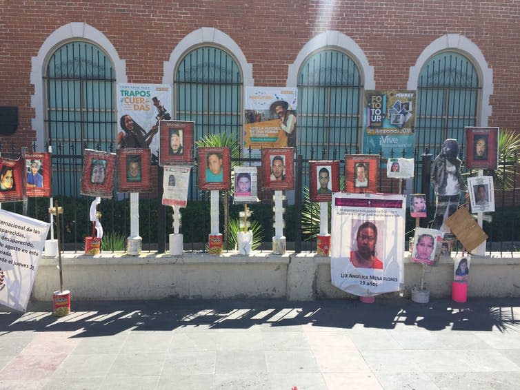 <span class="caption">Posters in Ciudad Juarez, Mexico, ask for information about missing relatives.</span> <span class="attribution"><span class="source">© Camilo Tamayo Gomez</span>, <span class="license">Author provided</span></span>