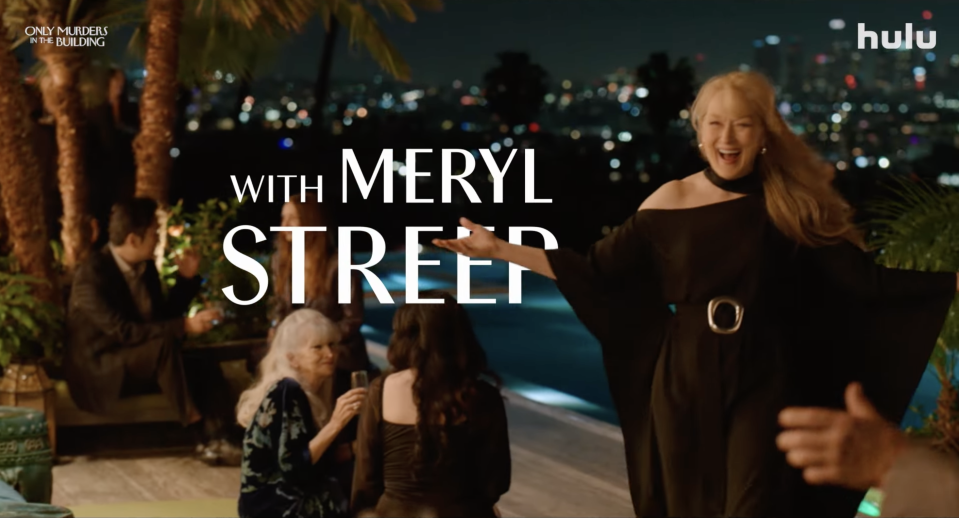 Meryl Streep, in an elegant off-the-shoulder dress, smiles warmly at a night event by a pool. The text displays, "Only Murders in the Building with Meryl Streep," and the Hulu logo
