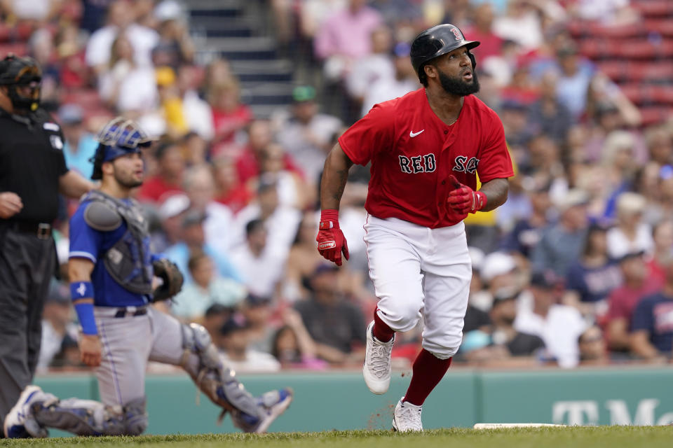 Boston Red Sox's Danny Santana watches his three-run homer in front of Kansas City Royals catcher Sebastian Rivero in the fourth inning of a baseball game at Fenway Park, Thursday, July 1, 2021, in Boston. (AP Photo/Elise Amendola)