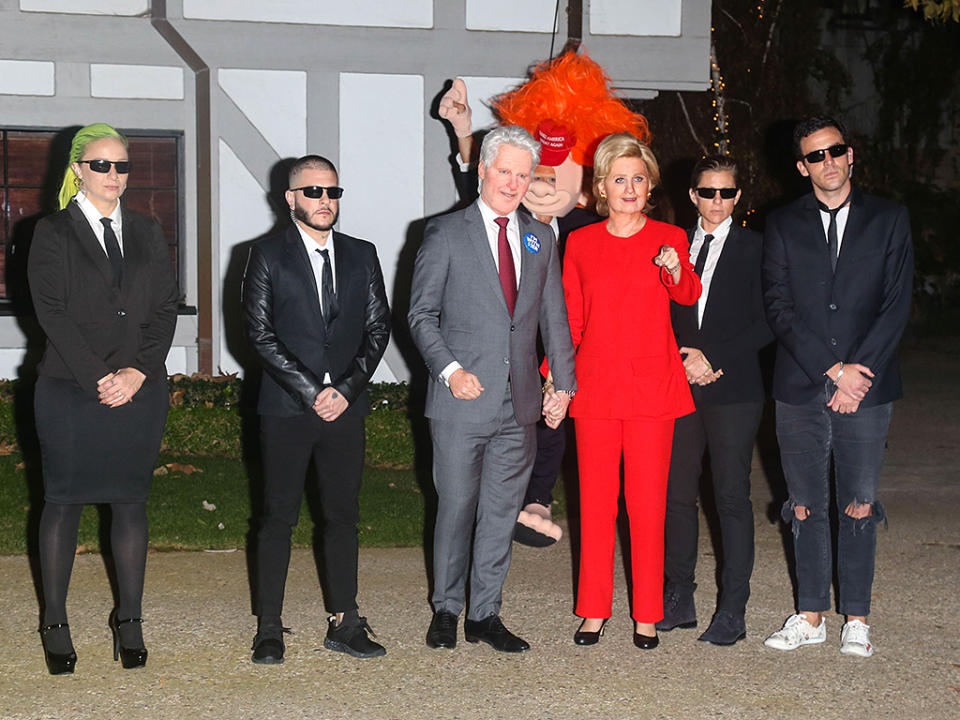 <p>Perry made her grand entrance as HRC wearing more clothing than we’ve ever seen her wear before! That’s her beau, Orlando Bloom, in the back dressed as a troll-like Donald Trump. (Photo: Bauer-Griffin) </p>