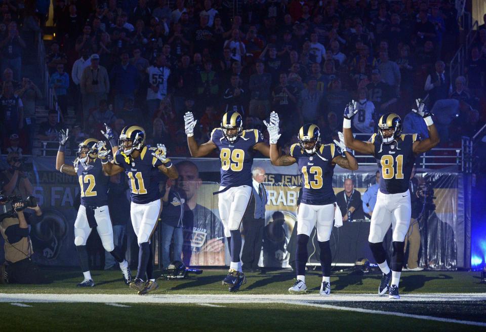 Nov 30, 2014 file photo; St. Louis, MO, USA; St. Louis Rams wide receiver Stedman Bailey (12) and wide receiver Tavon Austin (11) and tight end Jared Cook (89) and wide receiver Chris Givens (13) and wide receiver Kenny Britt (81) put their hands up to show support for Michael Brown before a game against the Oakland Raiders at the Edward Jones Dome. Mandatory Credit: Jeff Curry-USA TODAY Sports - (TPX IMAGES OF THE DAY SPORT)