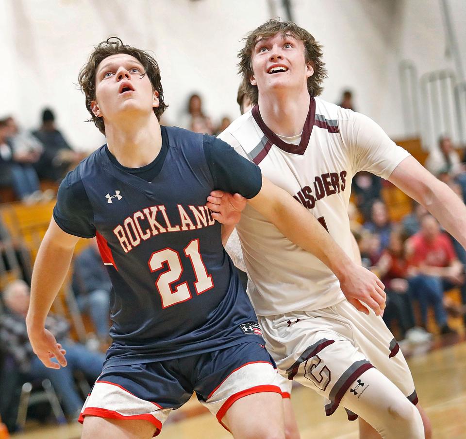 Bulldog Michael Moriarty and Crusader Joshua Grimes look for a rebound.The Carver Crusaders hosted Rockland Bulldogs boys basketball in MIAA action on Friday February 10, 2023 