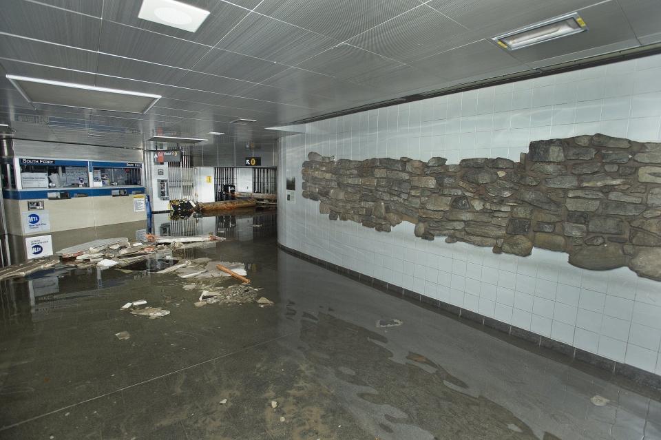 This photo provided by the Metropolitan Transportation Authority shows the South Ferry subway station after it was flooded by seawater during superstorm Sandy on Tuesday, Oct. 30, 2012. Sandy, the storm that made landfall Monday, caused multiple fatalities, halted mass transit and cut power to more than 6 million homes and businesses. (AP Photo/ Metropolitan Transportation Authority)