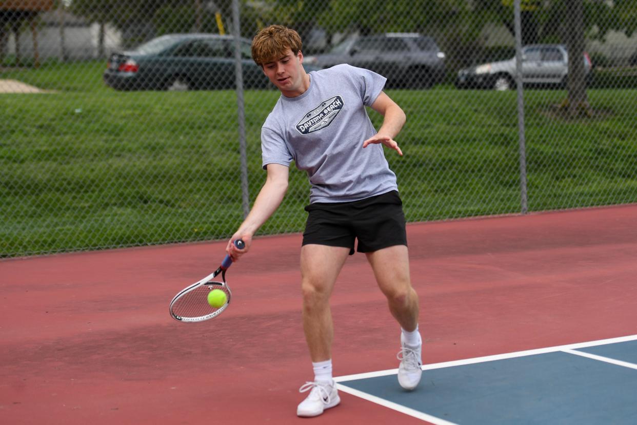 Lincoln's Rocky McKenzie hits the tennis ball during practice on Thursday, May 9, 2024 at Lincoln High School in Sioux Falls.