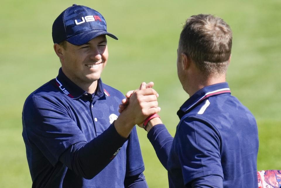 Team USA's Jordan Spieth and Team USA's Justin Thomas celebrate after winning their foursomes match the Ryder Cup at the Whistling Straits Golf Course Saturday, Sept. 25, 2021, in Sheboygan, Wis. (AP Photo/Ashley Landis)