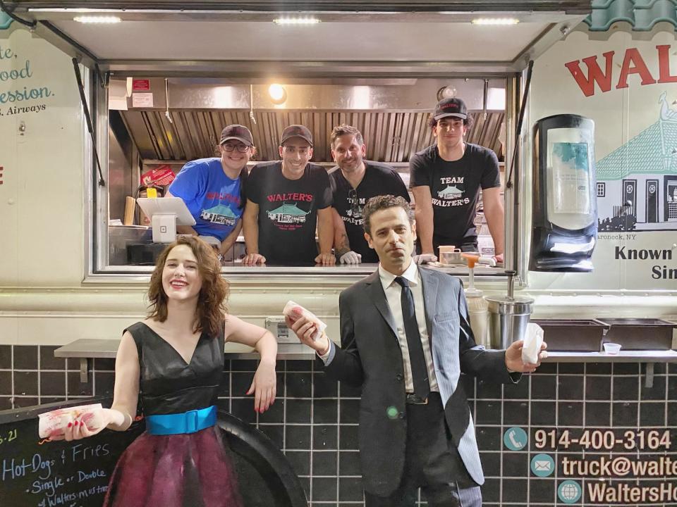 Rachel Brosnahan aka Midge Maisel, left, with Luke Kirby (who plays Lenny Bruce), right, with the Walter's Hot Dog crew. Gene Christian Baca, co-owner of Walter's, is pictured second to left behind the actors.