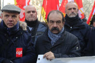 CGT union leader Philippe Martinez, second right,, takes part a demonstration, Friday, Jan. 24, 2020 in Paris. French unions are holding last-ditch strikes and protests around the country Friday as the government unveils a divisive bill redesigning the national retirement system. (AP Photo/Michel Euler)