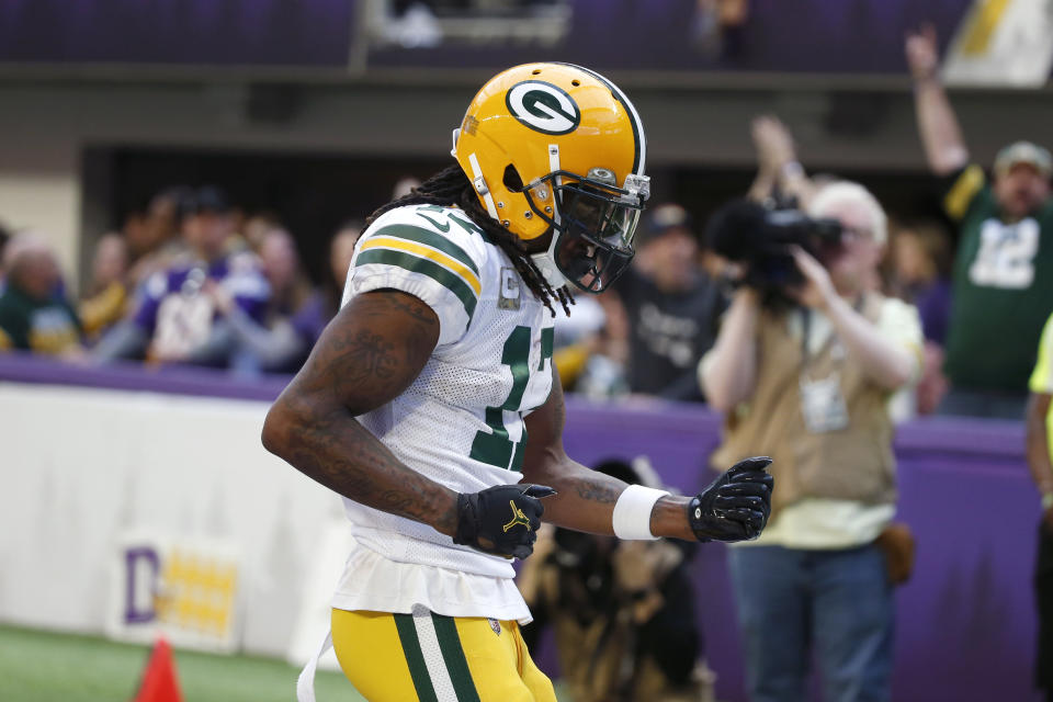 Green Bay Packers wide receiver Davante Adams (17) celebrates after catching an 18-yard touchdown pass during the second half of an NFL football game against the Minnesota Vikings, Sunday, Nov. 21, 2021, in Minneapolis. (AP Photo/Bruce Kluckhohn)