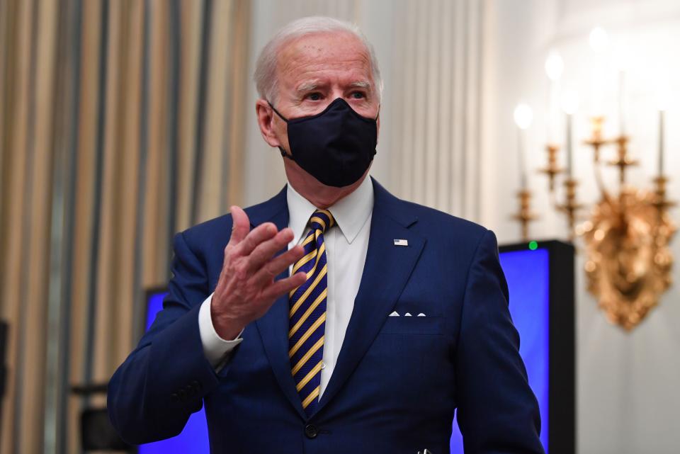President Joe Biden speaks about the Covid-19 response before signing executive orders for economic relief on 22 January, 2021 (AFP via Getty Images)