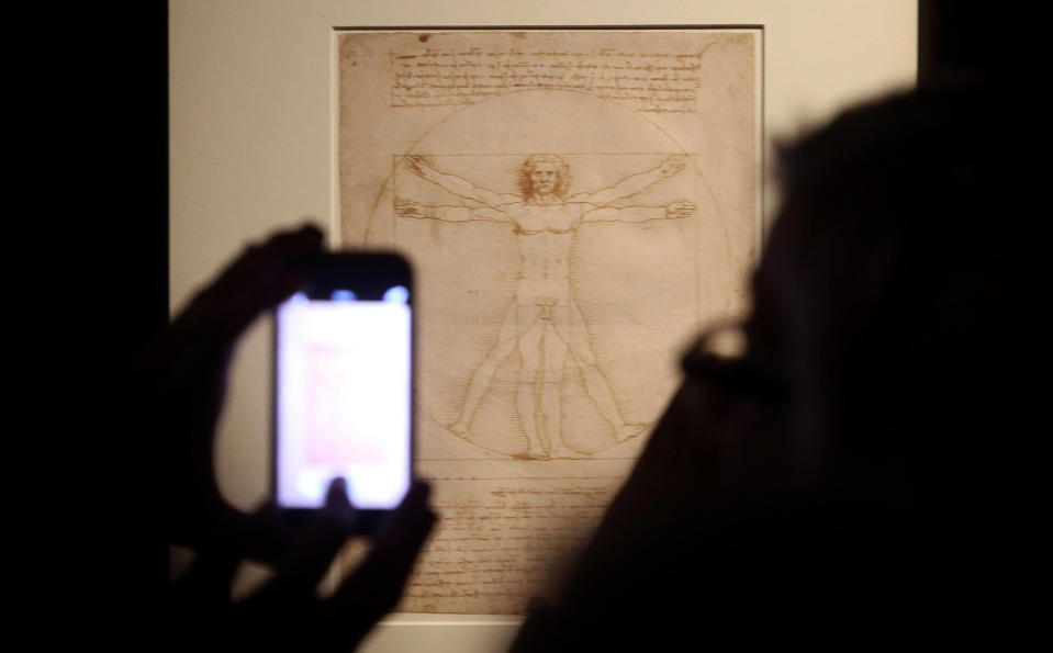 This Tuesday April 14, 2015 photo made available Tuesday Oct. 8, 2019 shows Leonardo da Vinci's "Vitruvian Man" during an exhibition in Milan, Italy. An administrative court in Venice has temporarily suspended Tuesday Oct. 8, 2019 the loan of Leonardo da Vinci's "Vitruvian Man" to the Louvre for an exhibition that is set to open later this month. (Matteo Bazzi/ANSA via AP)