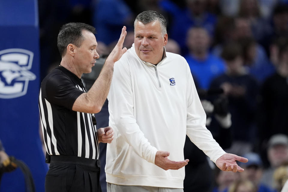 Creighton head coach Greg McDermott, right, questions a calll during the first half of an NCAA college basketball game against Xavier, Tuesday, Jan. 23, 2024, in Omaha, Neb. (AP Photo/Charlie Neibergall)