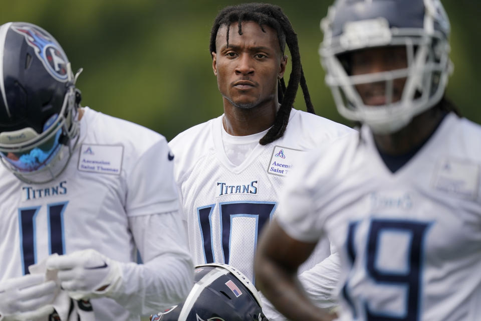 Tennessee Titans wide receiver DeAndre Hopkins, center, waits for the next drill with his teammates during an NFL football training camp practice Wednesday, July 26, 2023, in Nashville, Tenn. (AP Photo/George Walker IV)