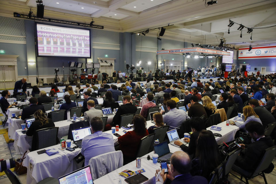 Members of the media gather to cover a broadcast of a Democratic presidential primary debate, Tuesday, Feb. 25, 2020, in Charleston, S.C. (AP Photo/Matt Rourke)