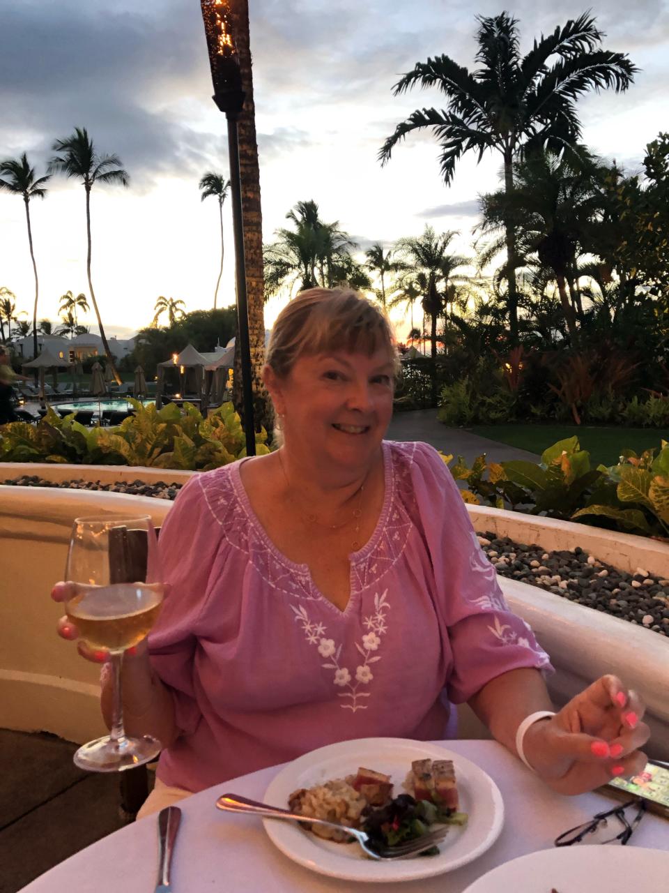 University of Buffalo professor Thomas Russo's wife,  Johanna Calvert, while patio dining in Maui, Hawaii.