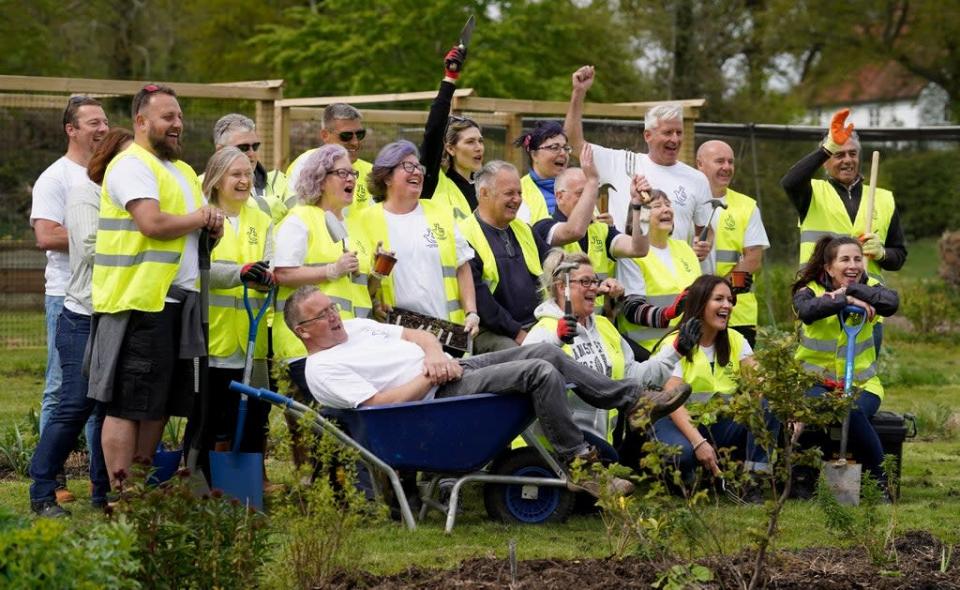 Twenty-one National Lottery winners, with a combined wealth of &#xa3;146 million, help to lay paths and fences at Rocks Farm Oast, in Hastings, Sussex, after volunteering to help the Veterans&#x002019; Growth charity. Picture date: Thursday April 28, 2022 (Gareth Fuller/PA) (PA Wire)