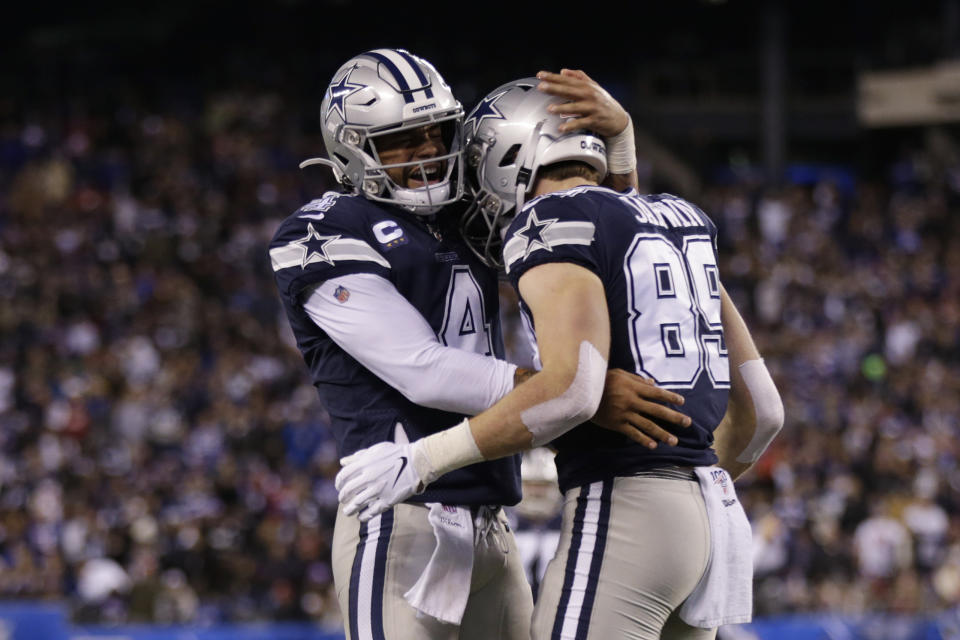 Dallas Cowboys quarterback Dak Prescott (4) celebrates with tight end Blake Jarwin (89) after Jarwin scored a touchdown against the New York Giants last season. (AP Photo/Adam Hunger)