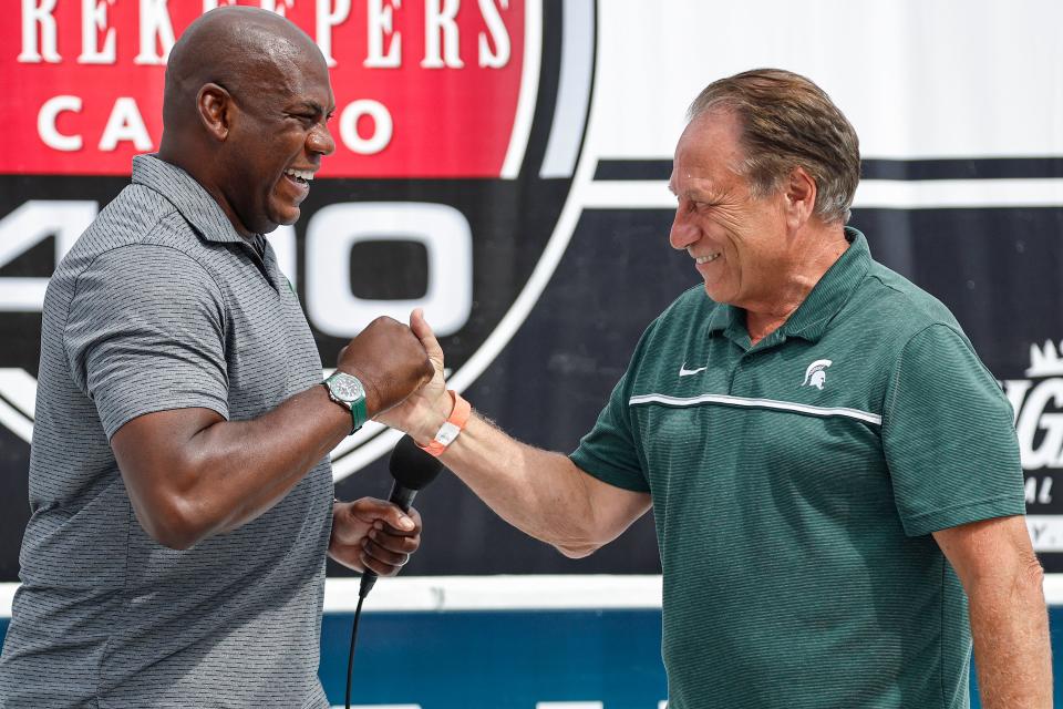 Michigan State football coach Mel Tucker, left, and basketball coach Tom Izzo shake hands after giving the command to start engine prior to the NASCAR Cup Series FireKeepers Casino 400 at Michigan International Speedway on Sunday, Aug. 7, 2022, in Brooklyn.