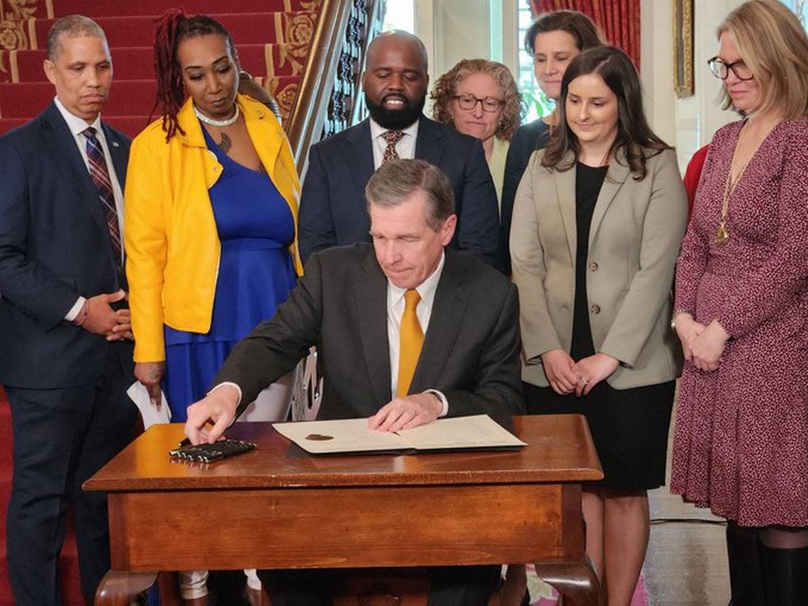 North Carolina Gov. Roy Cooper signed an executive order establishing the Office of Violence Prevention at the N.C. Department of Public Safety, at the Executive Mansion in downtown Raleigh on Tuesday, March 14, 2023.