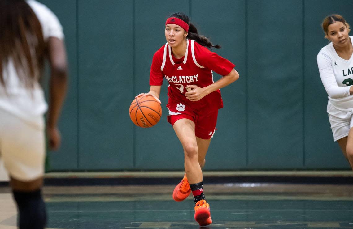 The McClatchy Lions’ Nina Cain (22) dribbles downcourt during the second quarter at the high school girls basketball game Friday, Jan. 27, 2023, at Monterey Trail High School in Elk Grove.