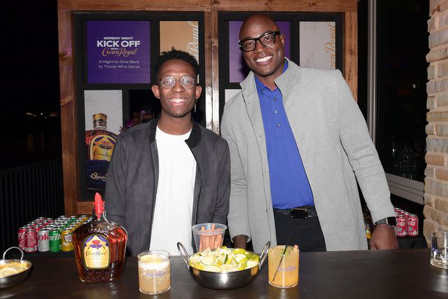 <p>Marcus Ingram/Getty</p> BRELAND and DeMarcus Ware pose as Crown Royal hosts NFL watch party for US Military in San Antonio, Texas on Nov. 27, 2023