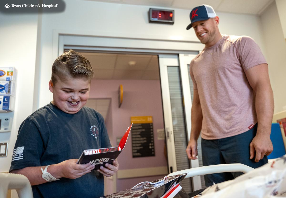 JJ Watt with Baby Son at Houston Texans Ring of Honor Induction