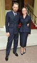 <p>Of course British designer Stella McCartney would know exactly what to wear while visiting the Queen at Buckingham Palace to receive an OBE: a navy suit, velvet pumps, and a fishnet fascinator.</p>
