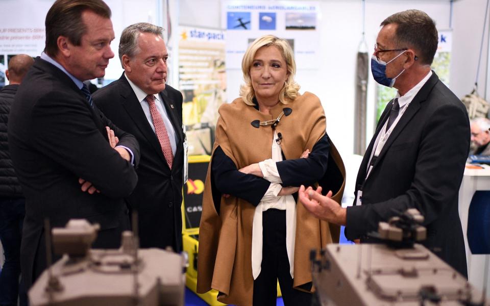 Marine Le Pen visits the Business Exhibition Defense (in French 'Forum Entreprises Defense') in Versailles, on the outskirts of Paris on Thursday - AFP