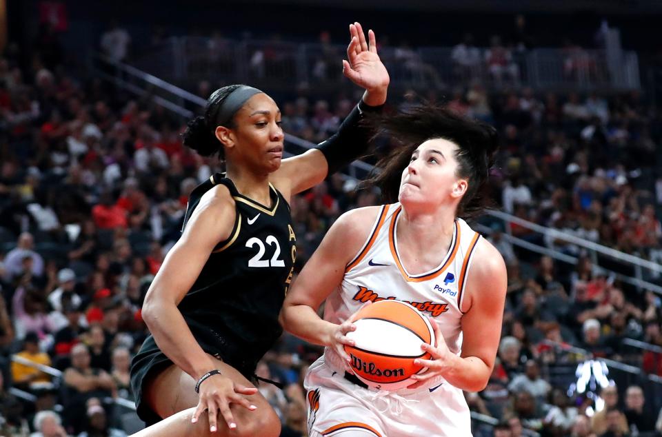 Las Vegas Aces forward A'ja Wilson (22) guards against Phoenix Mercury center Megan Gustafson, right, during the first half of a WNBA basketball game Sunday, Sept. 10, 2023, in Las Vegas.