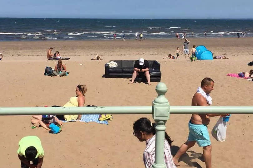 One sunseeker went viral after hauling a leather sofa to Portobello beach -Credit:PA