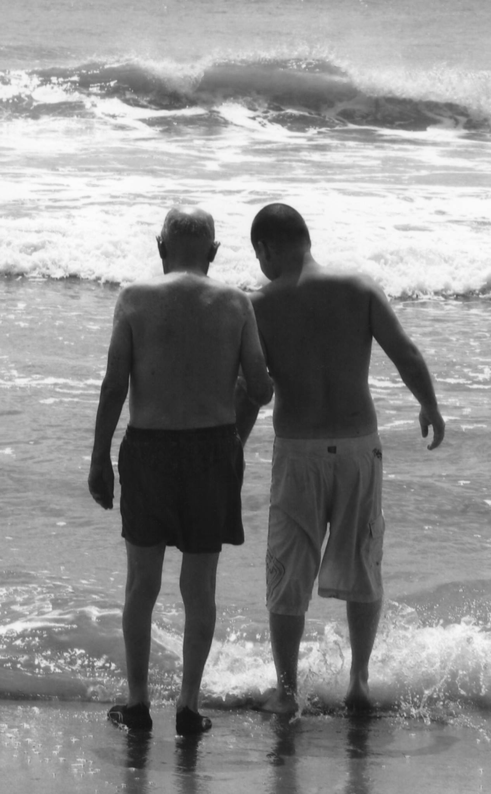 From the family's 2014 vacation to Ocracoke, Sullivan's nephew helps her now late father enter the water. She said it was her father who taught the nephew how to swim many years ago.