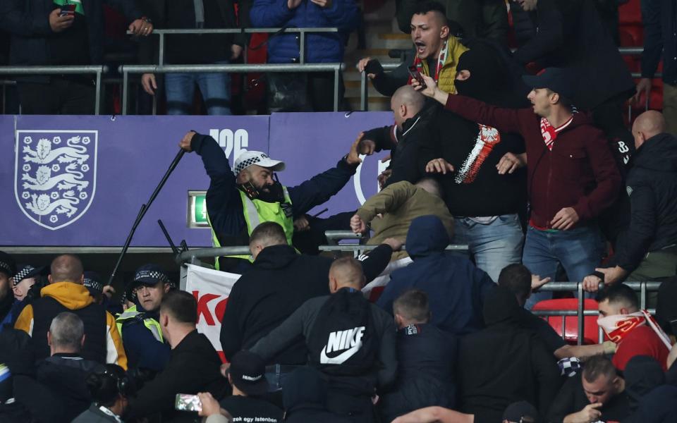 Hungary fans clash with police inside Wembley during World Cup qualifier with England - GETTY IMAGES