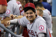 Los Angeles Angels' Shohei Ohtani smiles in the dugout during the fifth inning of the team's baseball game game against the Los Angeles Dodgers on Friday, Aug. 6, 2021, in Los Angeles. (AP Photo/Marcio Jose Sanchez)