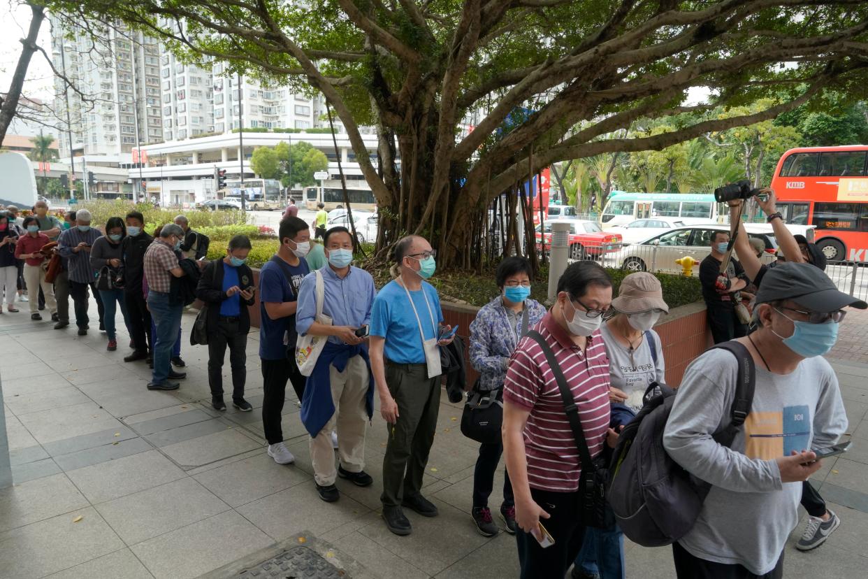 <p>File image - People line up to receive China's Sinovac coronavirus vaccine at a community vaccination centre in Hong Kong on  26 February</p> (AP)