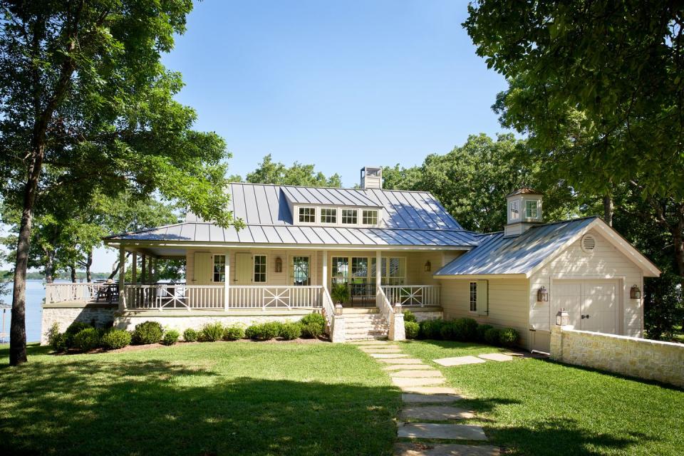 ivory ranch house with wraparound porch