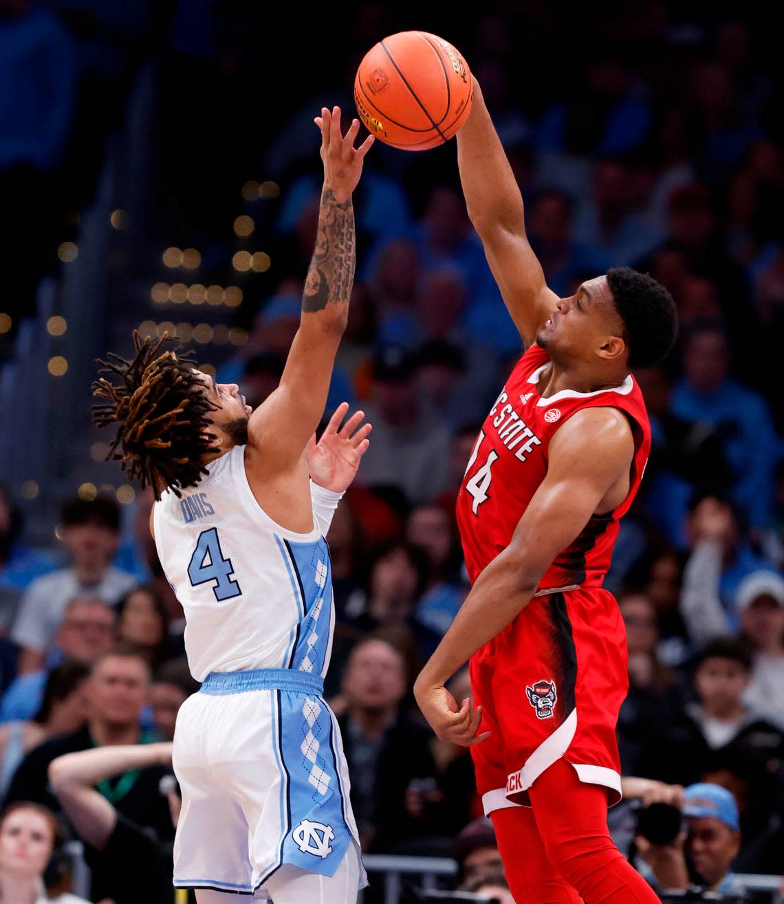 N.C. State’s Casey Morsell (14) blocks the shot by North Carolina’s RJ Davis (4) during the second half N.C. State’s 84-76 victory over UNC in the championship game of the 2024 ACC Men’s Basketball Tournament at Capital One Arena in Washington, D.C., Saturday, March 16, 2024.
