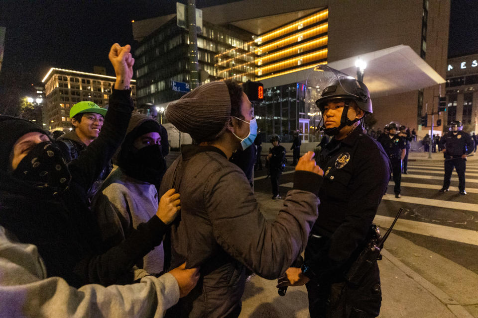 Protesters face off with police officers during a rally against the fatal police assault of Tyre Nichols in Los Angeles, California, on January 27, 2023.<span class="copyright">Qian Weizhong—VCG/Getty Images</span>