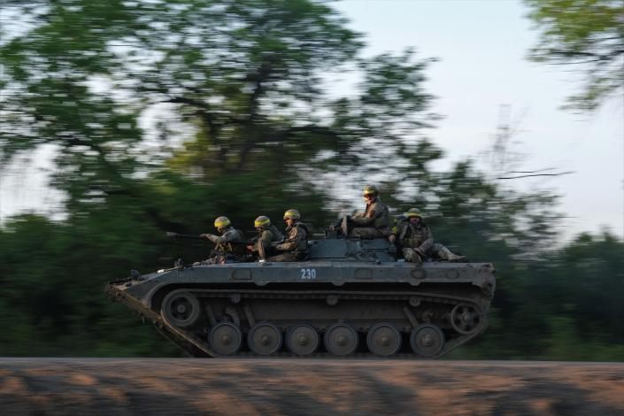 Ukrainian soldiers ride on a BMP infantry fighting vehicle toward Bakhmut, on May 20, 2023, amid the Russian invasion of Ukraine.