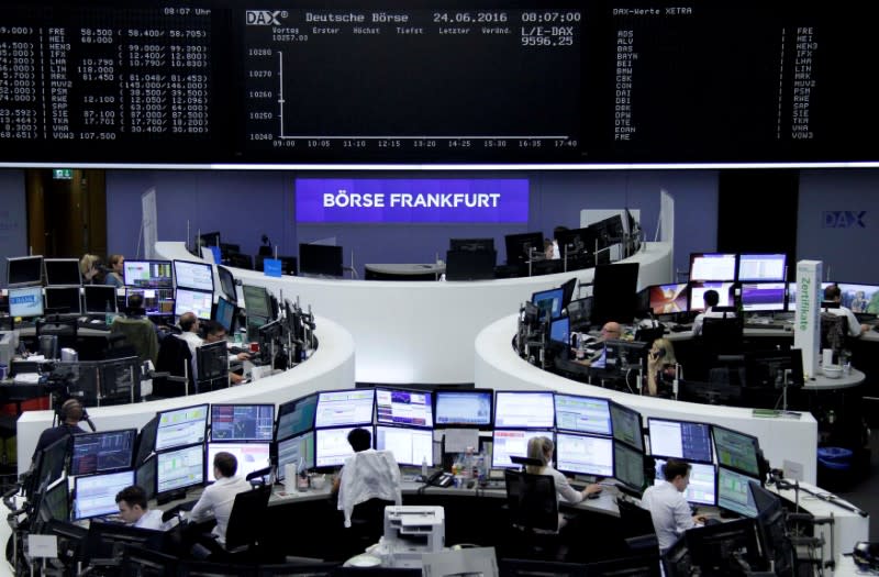 FILE PHOTO: Traders prepare before the opening of the German stock exchange in front of the empty DAX board, at the stock exchange in Frankfurt, Germany, June 24, 2016. REUTERS/Staff/Remote/File Photo