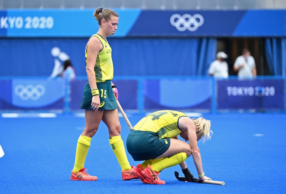 Australia's Stephanie Anna Kershaw (R) and Kaitlin Nobbs react after losing 1-0 to India in their women's quarter-final match of the Tokyo 2020 Olympic Games field hockey competition, at the Oi Hockey Stadium in Tokyo, on August 2, 2021. (Photo by CHARLY TRIBALLEAU / AFP) (Photo by CHARLY TRIBALLEAU/AFP via Getty Images)