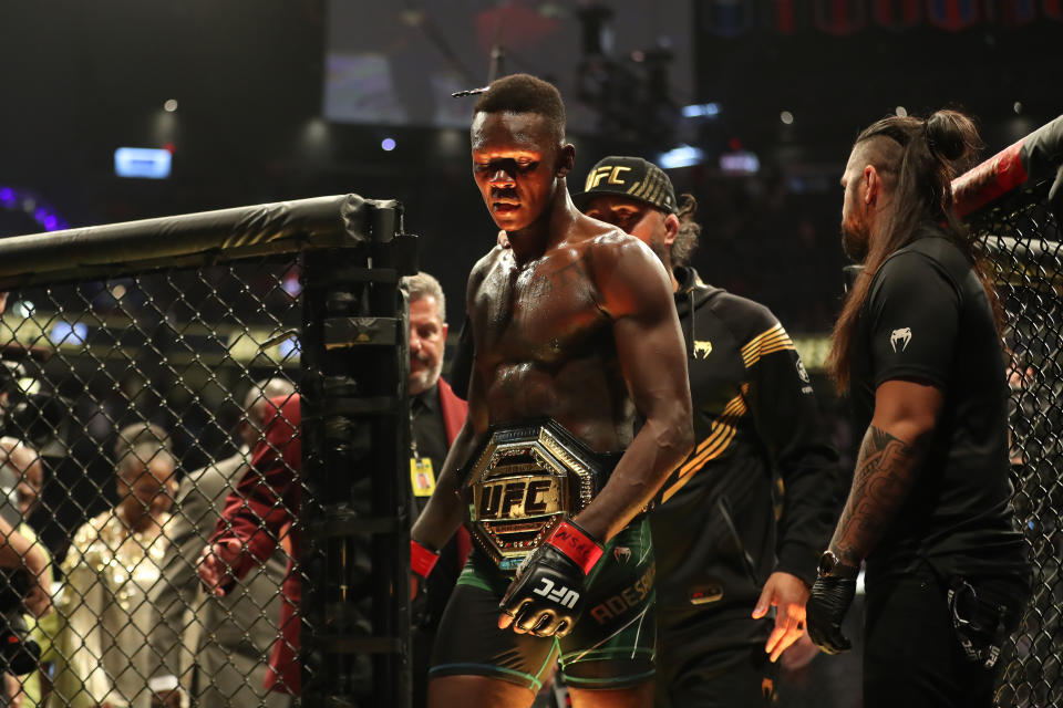 LAS VEGAS, NV - JULY 2: Israel Adesanya celebrates his victory over Jared Cannonier in their 5-round Middleweight title bout during UFC 276 on July 02, 2022, at T-Mobile Arena in Las Vegas, Nevada. (Photo by Alejandro Salazar/PxImages/Icon Sportswire via Getty Images)