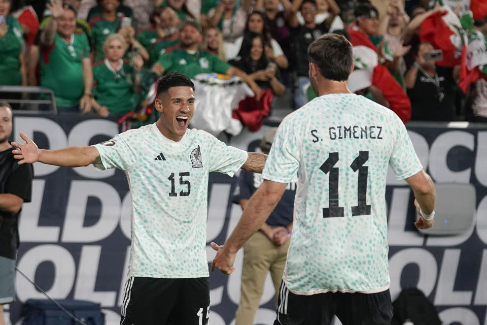 Mexico' Uriel Antuna (15) celebrates with Santiago Gimenez (11) after the team's third goal against Haiti, during the second half of a CONCACAF Gold Cup soccer match Thursday, June 29, 2023, in Glendale, Ariz. Mexico won 3-1. (AP Photo/Darryl Webb)