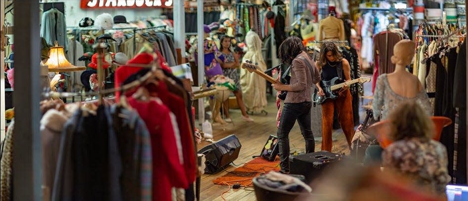 The backroom at Circa Vintage Clothing has a large amount of well-organized inventory to browse.